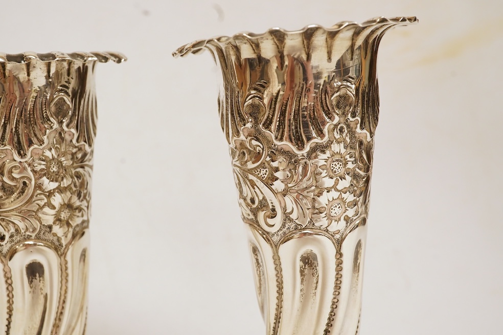 A pair of Edwardian silver spill vases, by S.W. Smith & Co, London, 1905, height 16.1cm, weighted, one split. Condition - poor